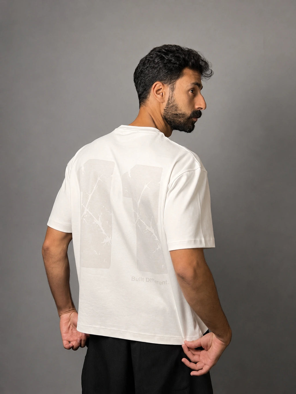 QAIROX Chapter Tee off-white back — oversized 11 cracked texture screen print, Built Different tagline, boxy fit