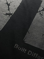 QAIROX Chapter Tee close-up — Qairox Chapter script with cracked texture 11 graphic, premium screen print detail on black cotton