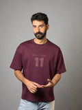 QAIROX Chapter Tee burgundy front — Qairox Chapter tone-on-tone 11 graphic, relaxed boxy fit, 285 GSM cotton