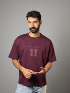 QAIROX Chapter Tee burgundy front — Qairox Chapter tone-on-tone 11 graphic, relaxed boxy fit, 285 GSM cotton