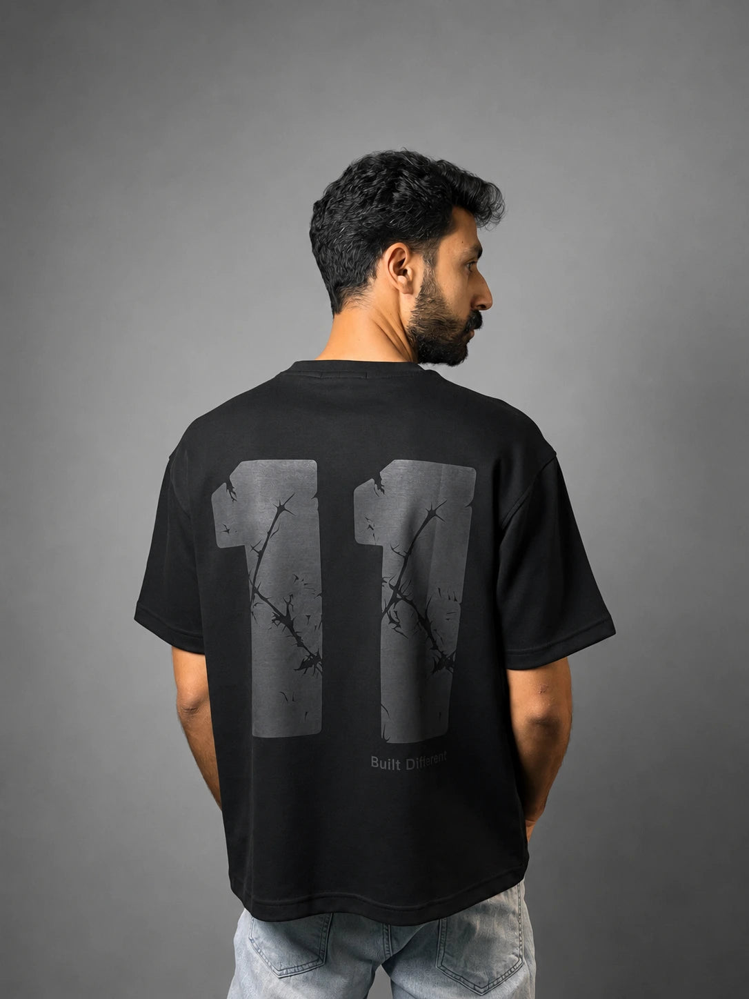 QAIROX Chapter Tee black back — oversized 11 graphic with thorn cracked texture screen print, Built Different tagline