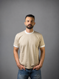 Man wearing QAIROX beige ringer tee with white contrast collar and cuffs